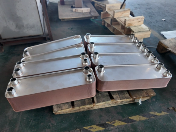 Finished brazed plate heat exchangers arranged on pallets inside the factory